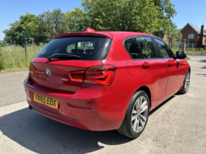 2015 BMW 1 Series 1.5 118i Sport 5-Door in Red — image 2